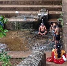 Deep tank with spring water on old hillside temple, Gokarna