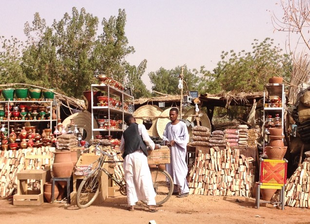 Selling firewood, charcoal, clay pots and other necessities at the small souk at Al Kabajab, Omdurman.
