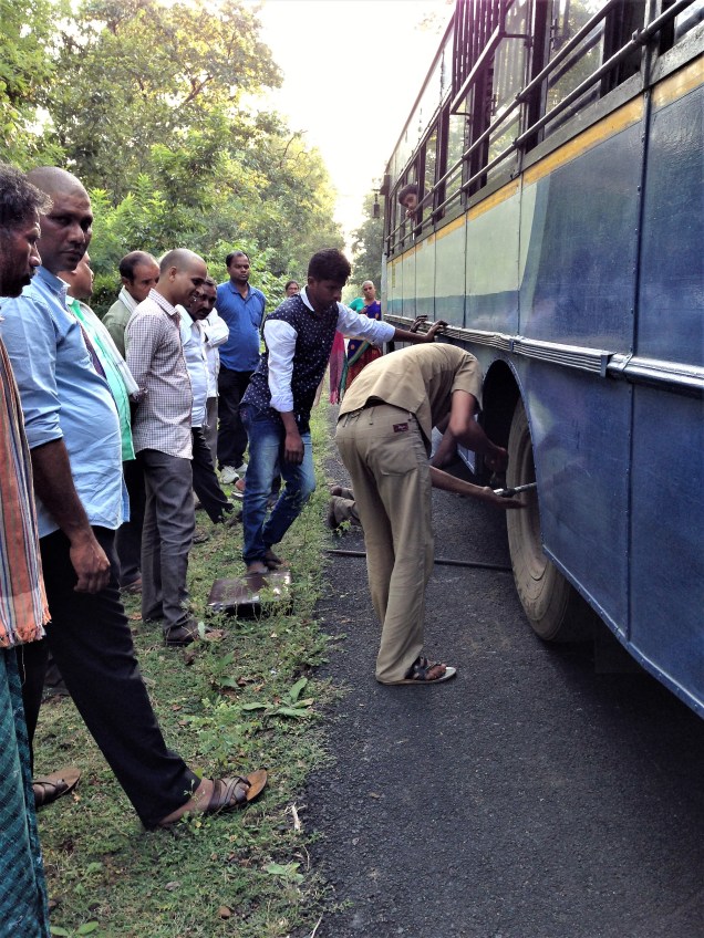Changing the wheel of the bus in eastern ghats, Andhra Pradesh