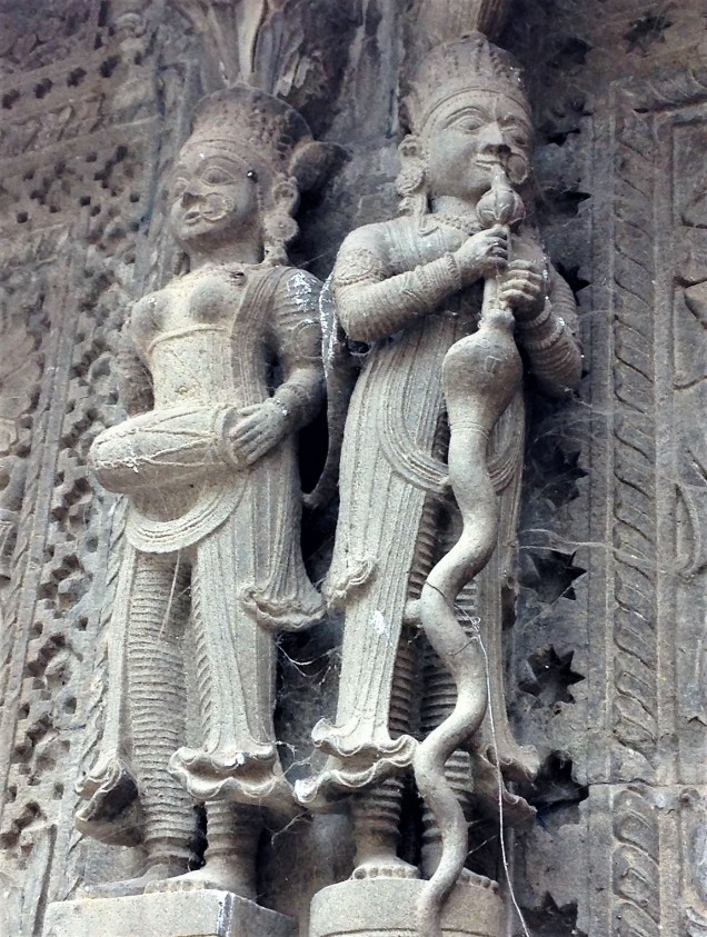 Drummer and snake charmer