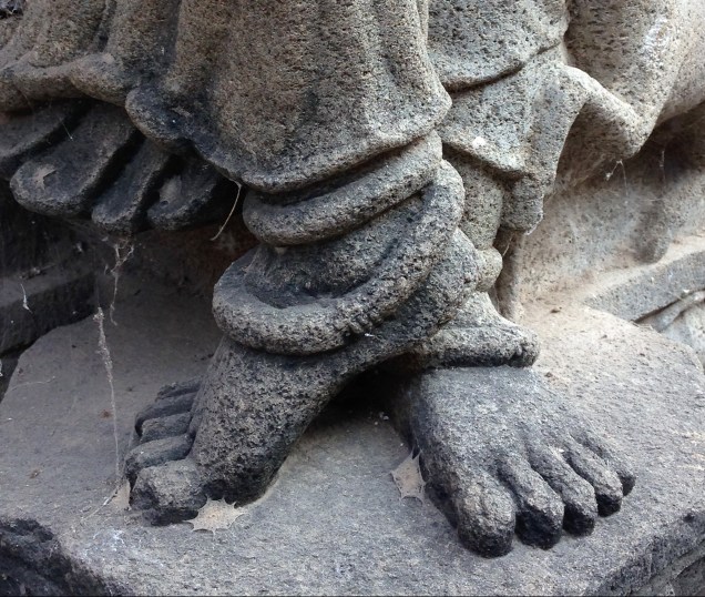 Photo of the feet of a dancer on the side of a temple in Maheshwar, Madhya Pradesh