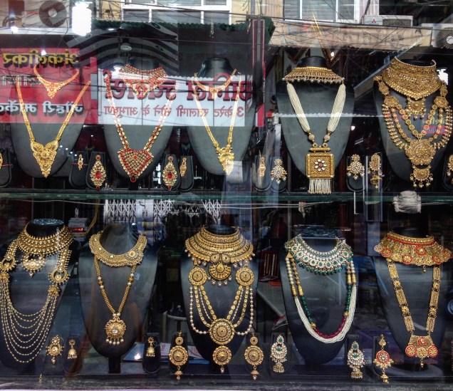 Photo of elaborate gold jewelry in a jeweler's window in Sarafa Bazaar, Indore, Madhya Pradesh.