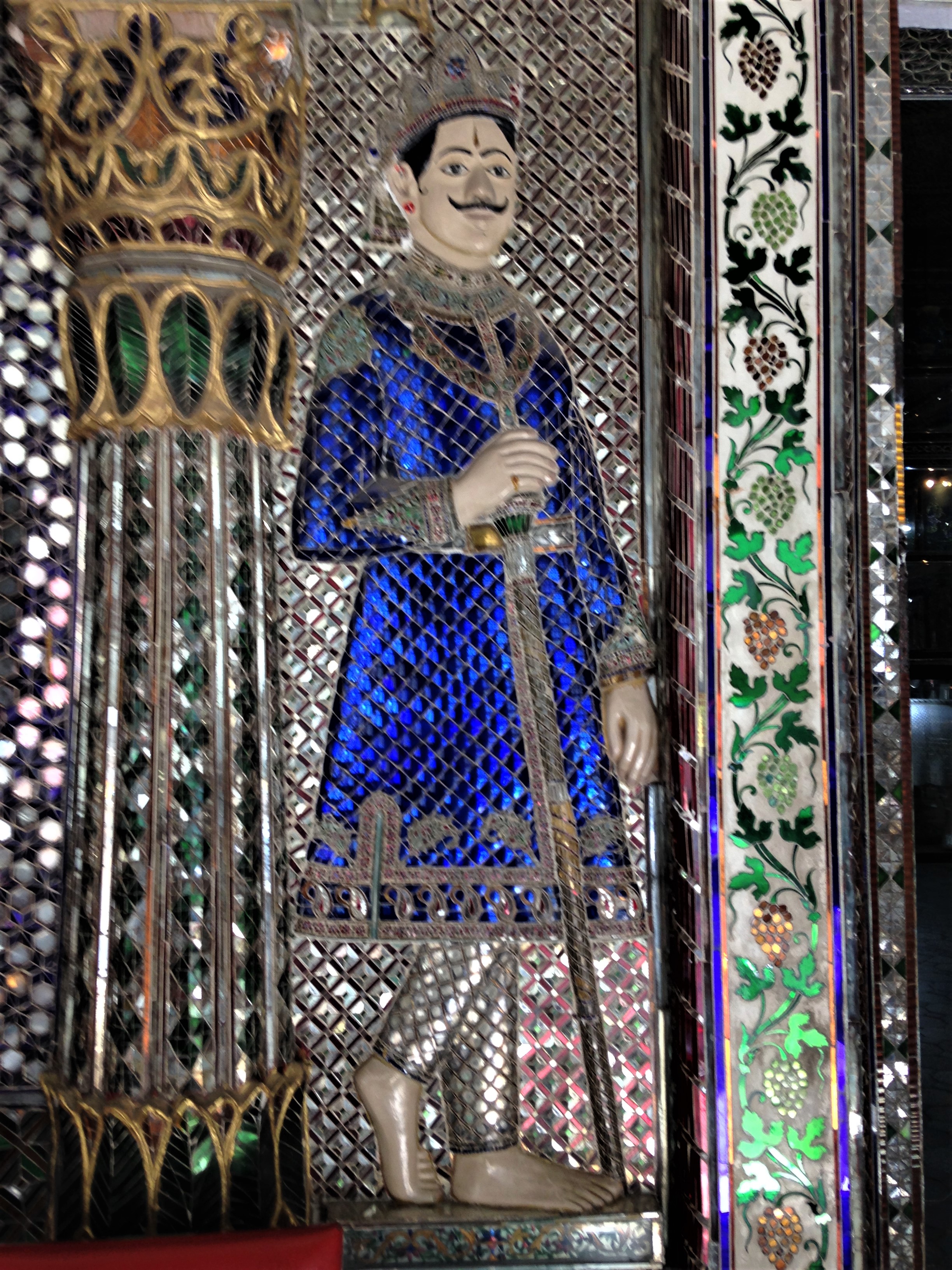 Just inside the Kanch Mandir is a temple guardian made of glass. Indore, Madhya Pradesh.