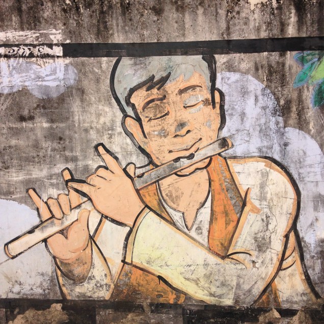 Flute player on wall mural, Guwahati