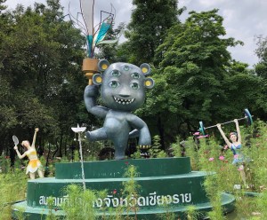 Sihuhata surrounded by flower fairies doing athletic activities, Chiang Rai, Thailand