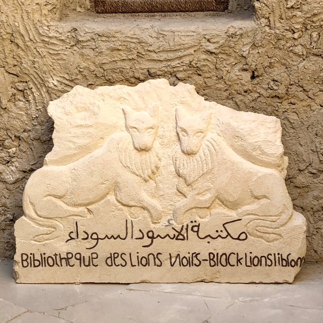 Carved stone sign for Black Lions Library